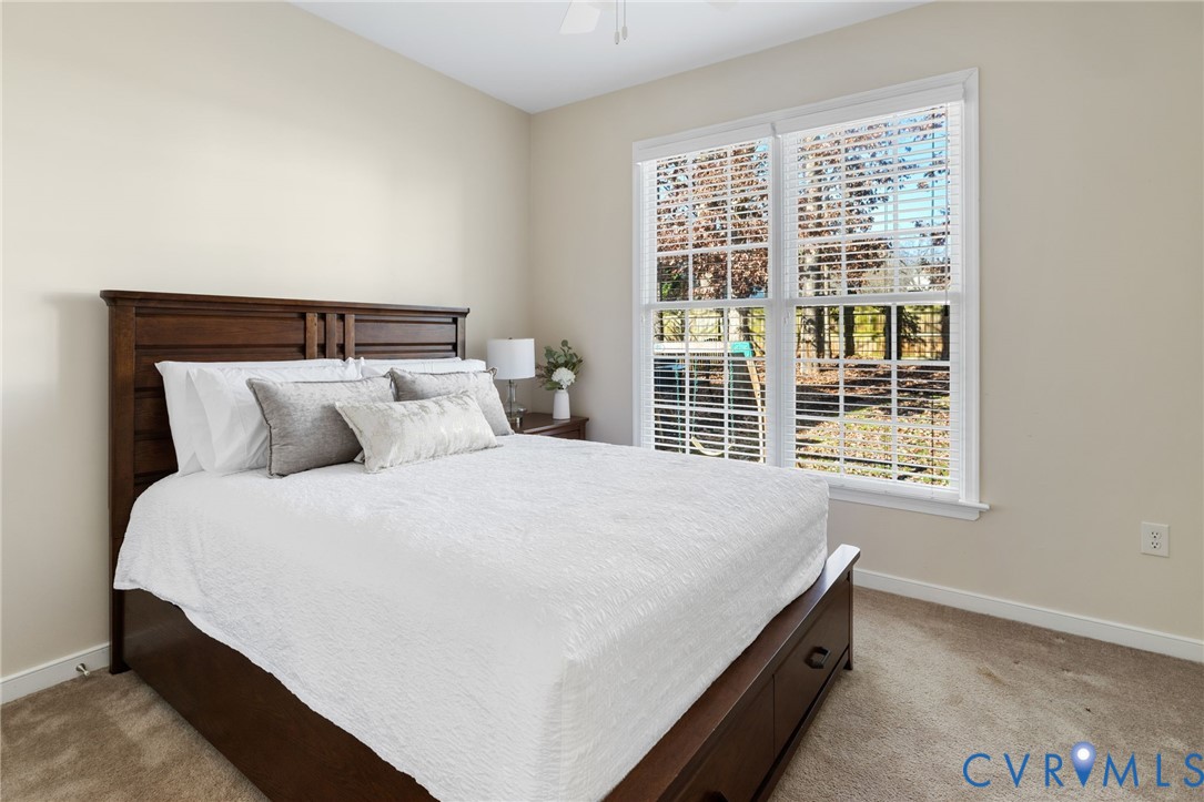 12008 Wheat Ridge Court Glen Allen, VA 23059 - Photo 10 of 36 a bedroom with a bed and a window