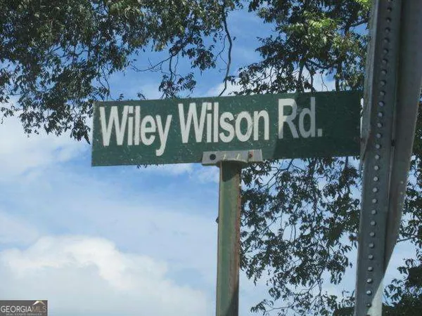 a sign board with a street sign