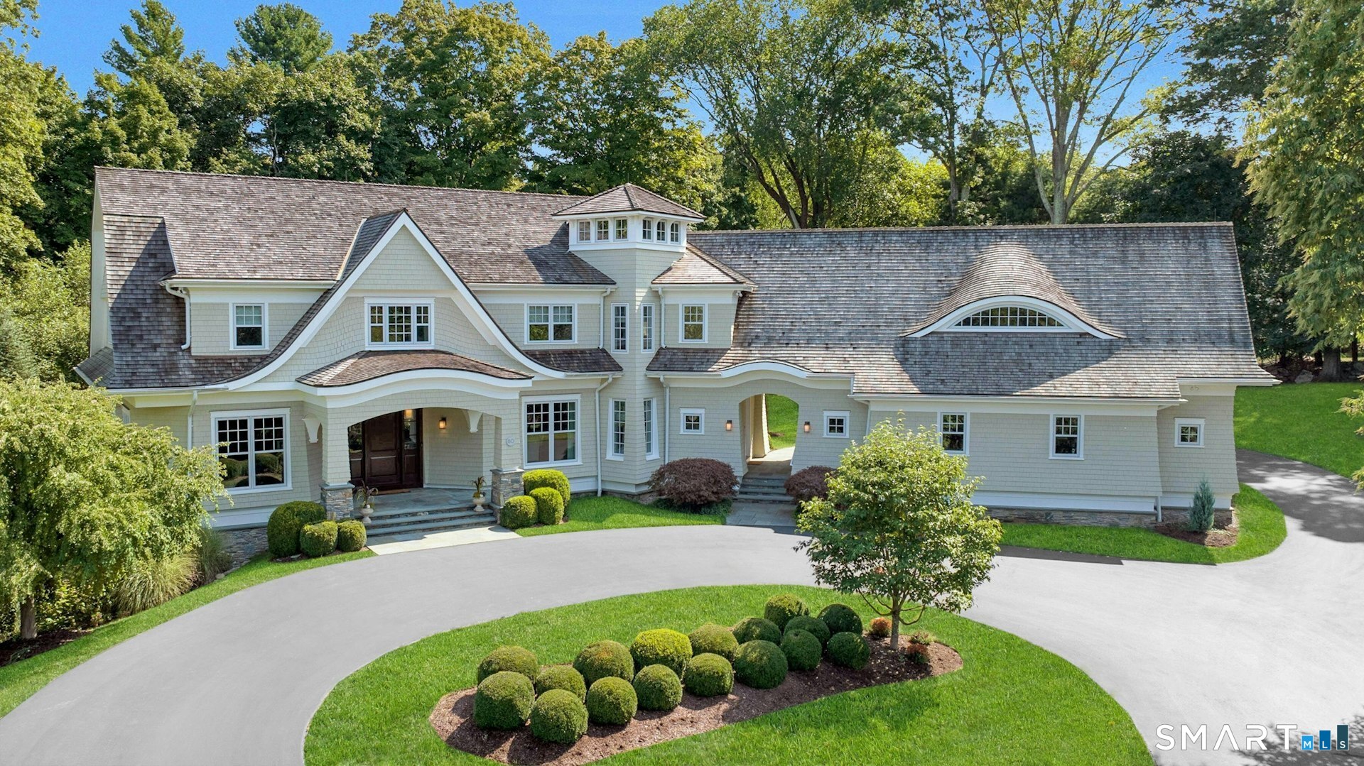80 Compo Road North Westport, CT 06880 - Photo 1 of 40 a front view of a house with a yard and potted plants