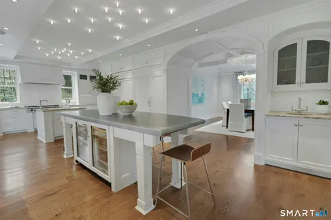 a kitchen with stainless steel appliances granite countertop a stove and a sink