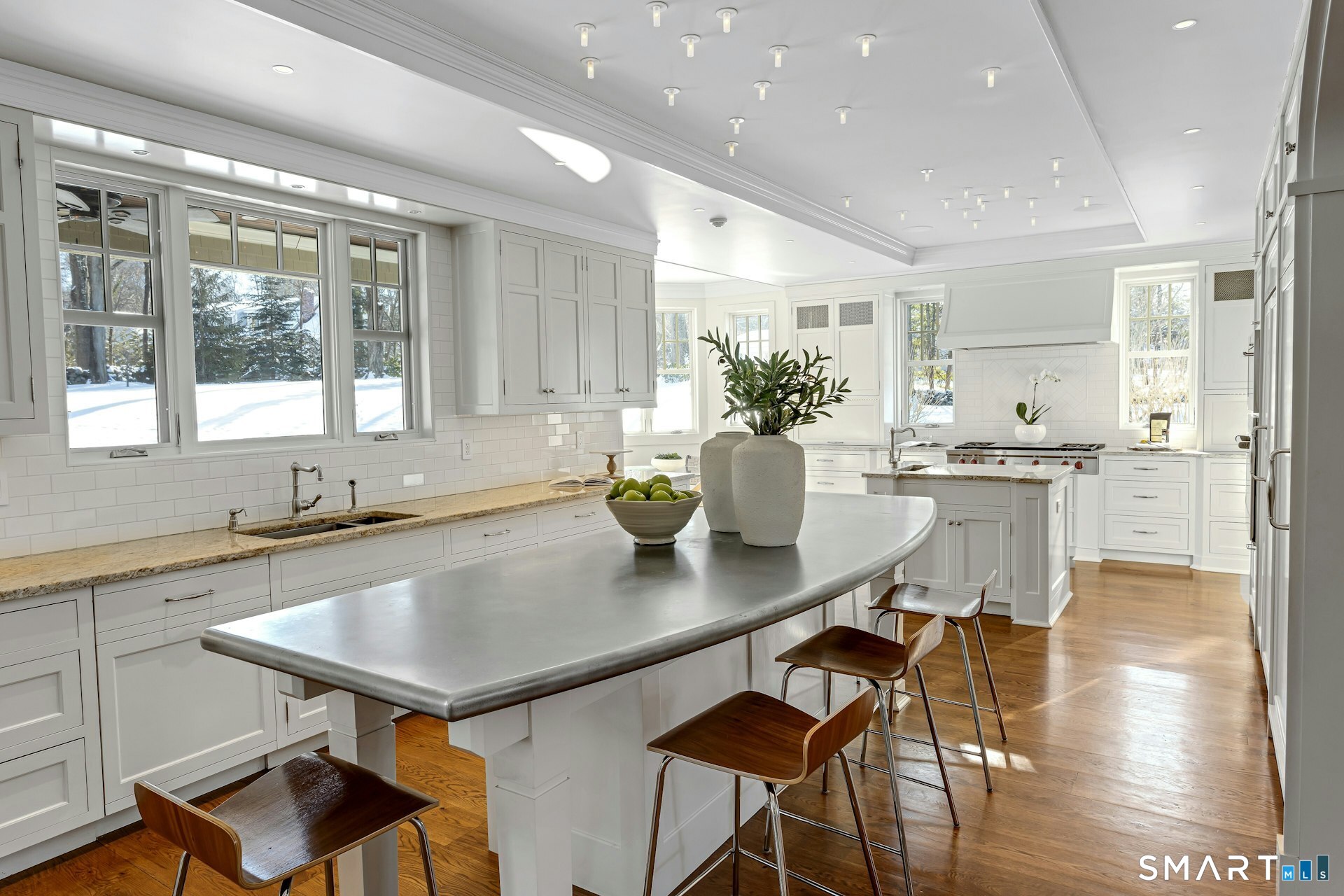 80 Compo Road North Westport, CT 06880 - Photo 14 of 40 a kitchen with a table chairs sink and cabinets