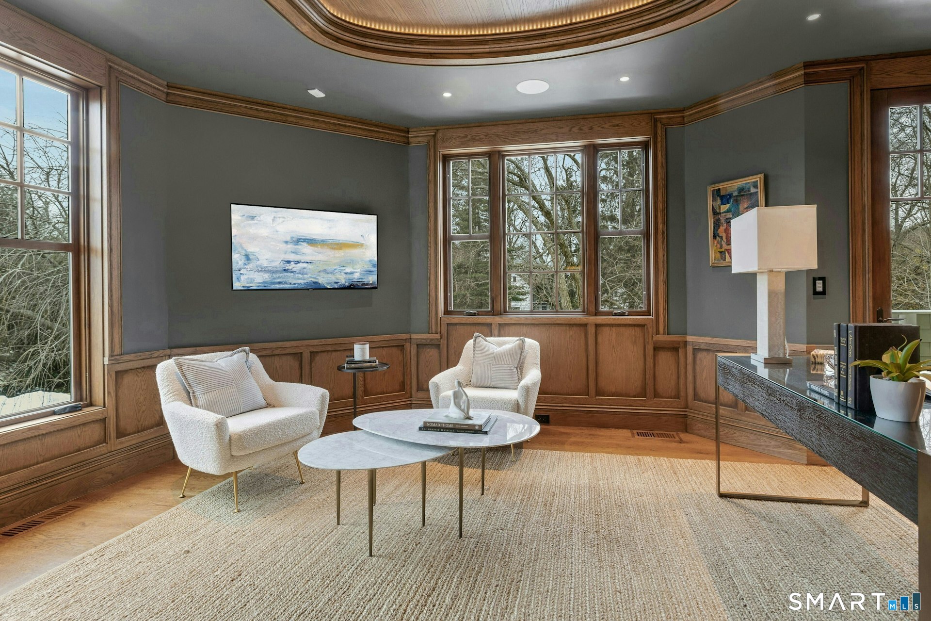 80 Compo Road North Westport, CT 06880 - Photo 17 of 40 a living room with furniture a large window and a flat screen tv