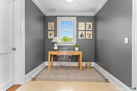 a workspace with furniture window and wooden floor