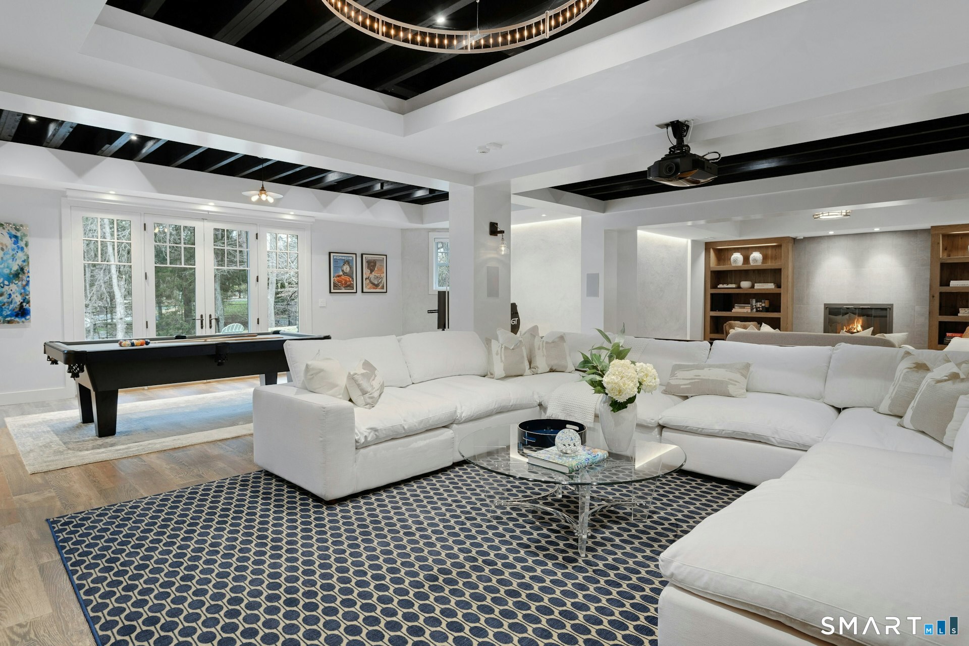 80 Compo Road North Westport, CT 06880 - Photo 26 of 40 a living room with furniture and a chandelier