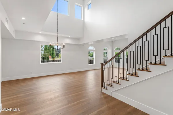 a view of an entryway with wooden floor