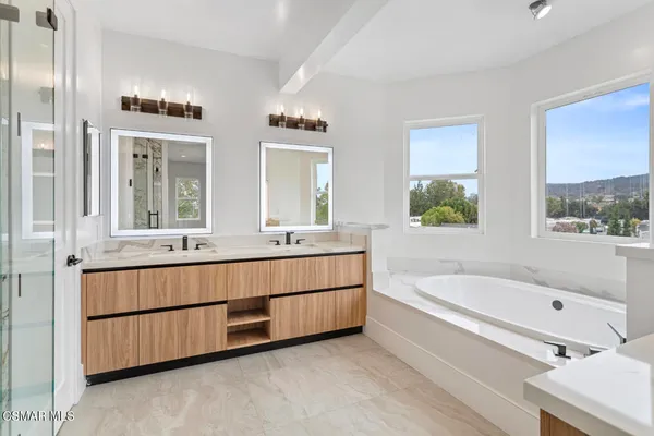 a bathroom with a bathtub and a sink