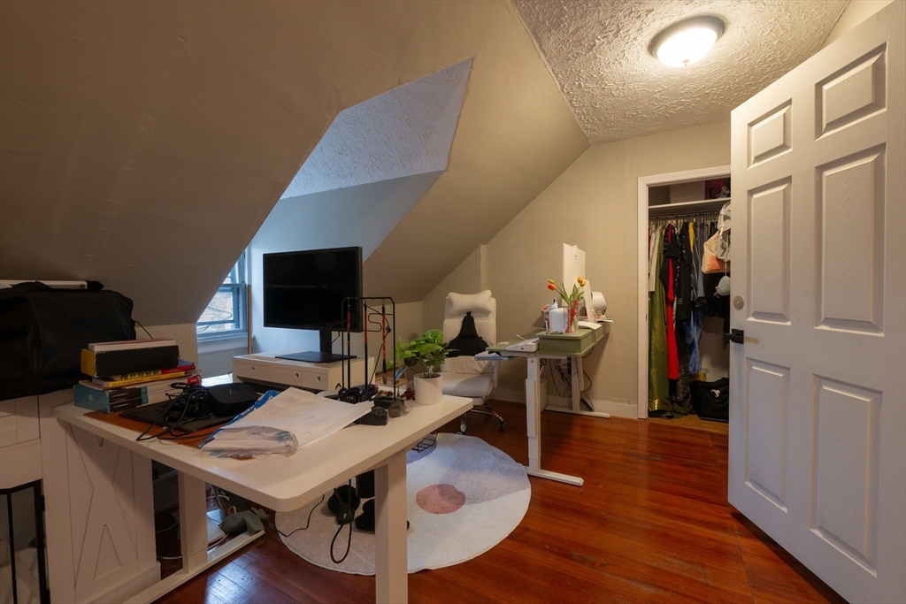 11 Wayne Street Boston, MA 02121 - Photo 22 of 27 a workspace with furniture and wooden floor
