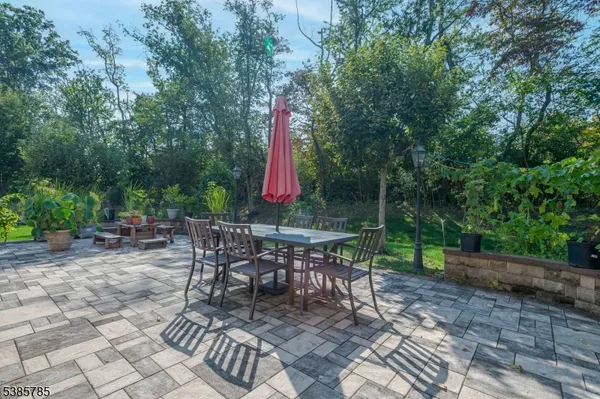 a view of a sitting area with furniture and wooden fence
