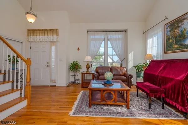 a living room with furniture fireplace and a window