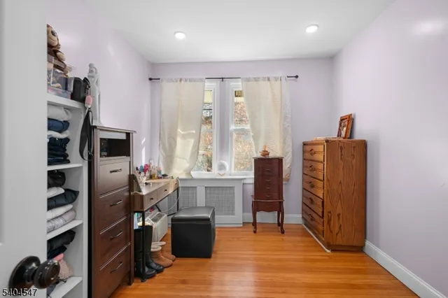 a room with furniture or wooden floor and a window