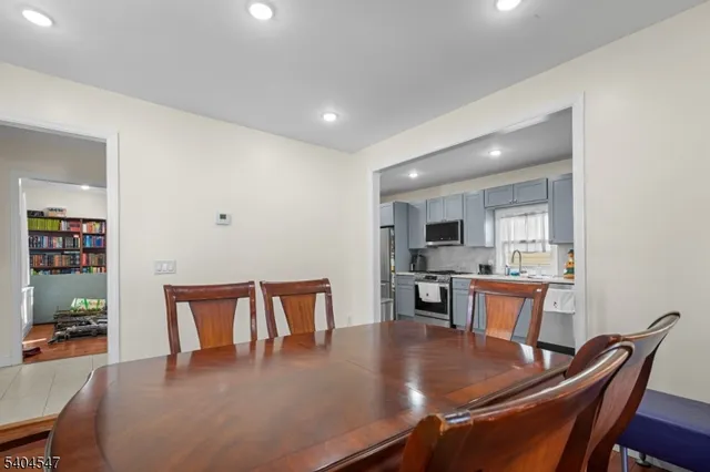 a dining room with furniture and wooden floor