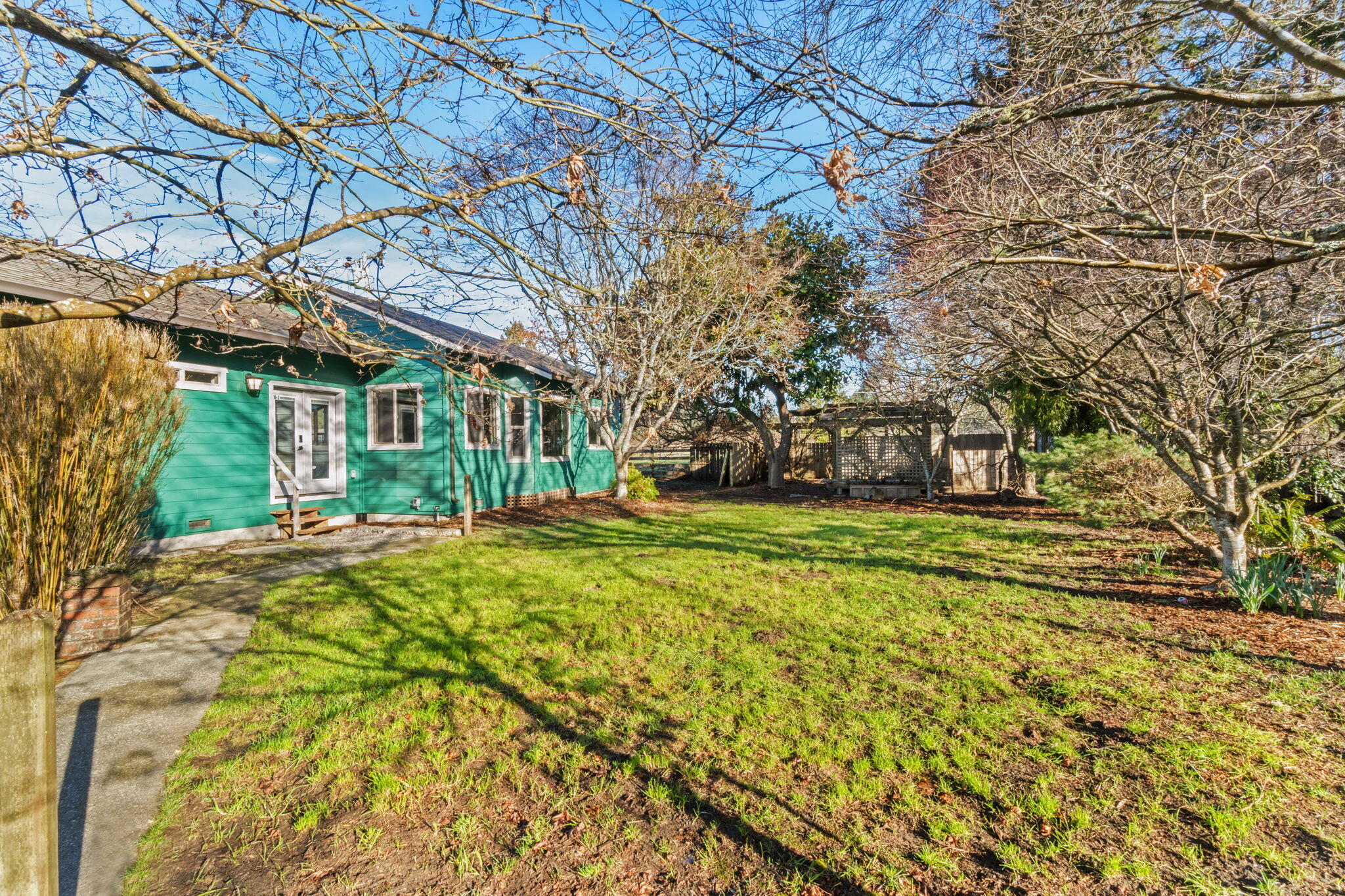 61 Kingston Road Fieldbrook, CA 95519 - Photo 23 of 48 a view of a house with a large tree and a yard