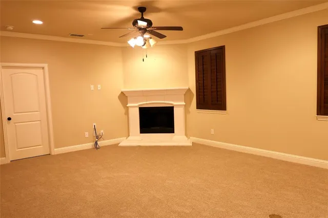 a view of an empty room with a fireplace