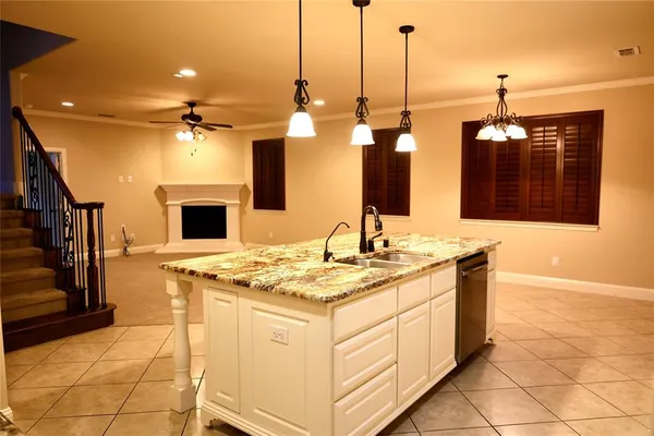 a kitchen that has a sink and a table in it