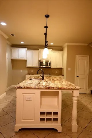 a kitchen with a stove and a cabinets