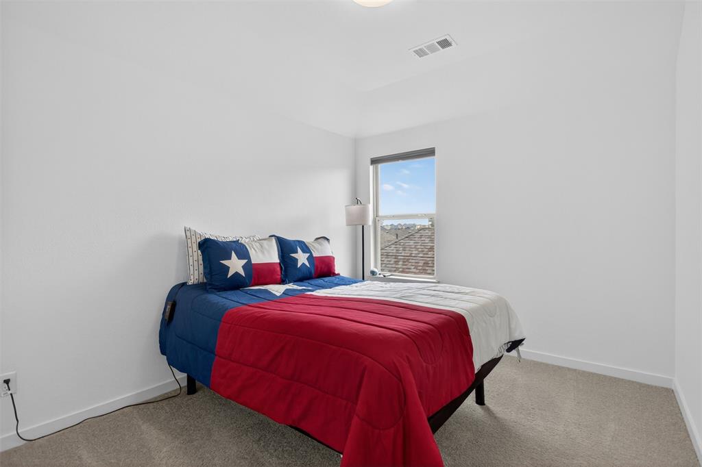 629 Claverton Lane Forney, TX 75126 - Photo 20 of 33 a bedroom with a bed and a window