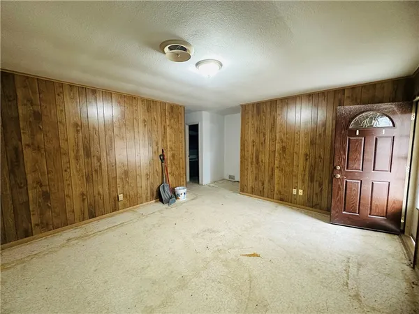 an empty room with entrance door