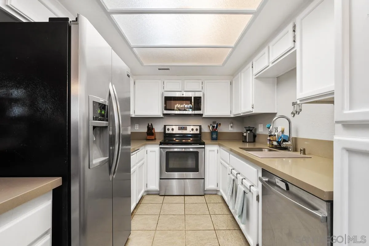 13975 Midland Road Poway, CA 92064 - Photo 11 of 33 a kitchen with a sink stove and refrigerator