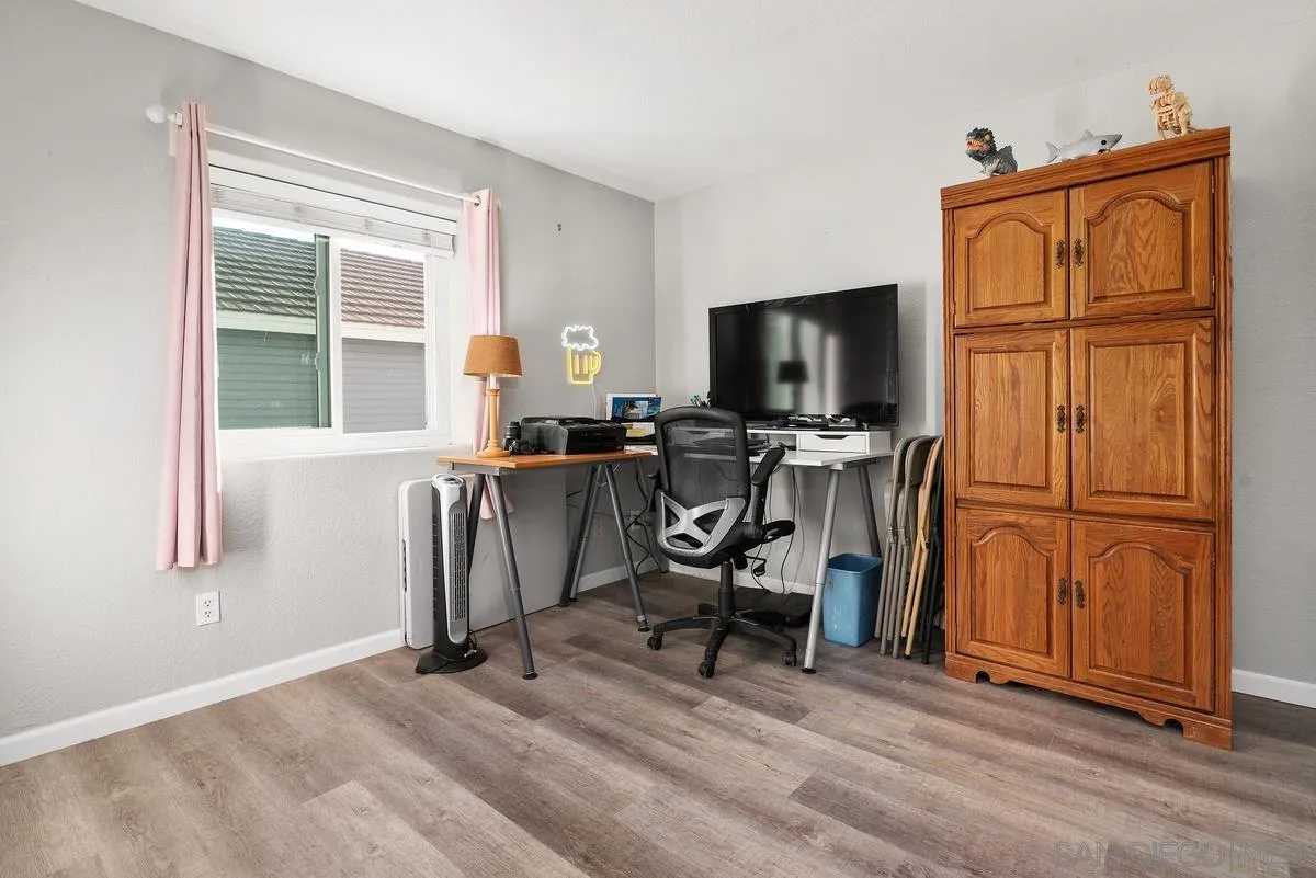 13975 Midland Road Poway, CA 92064 - Photo 21 of 33 a view of a workspace with furniture and a window