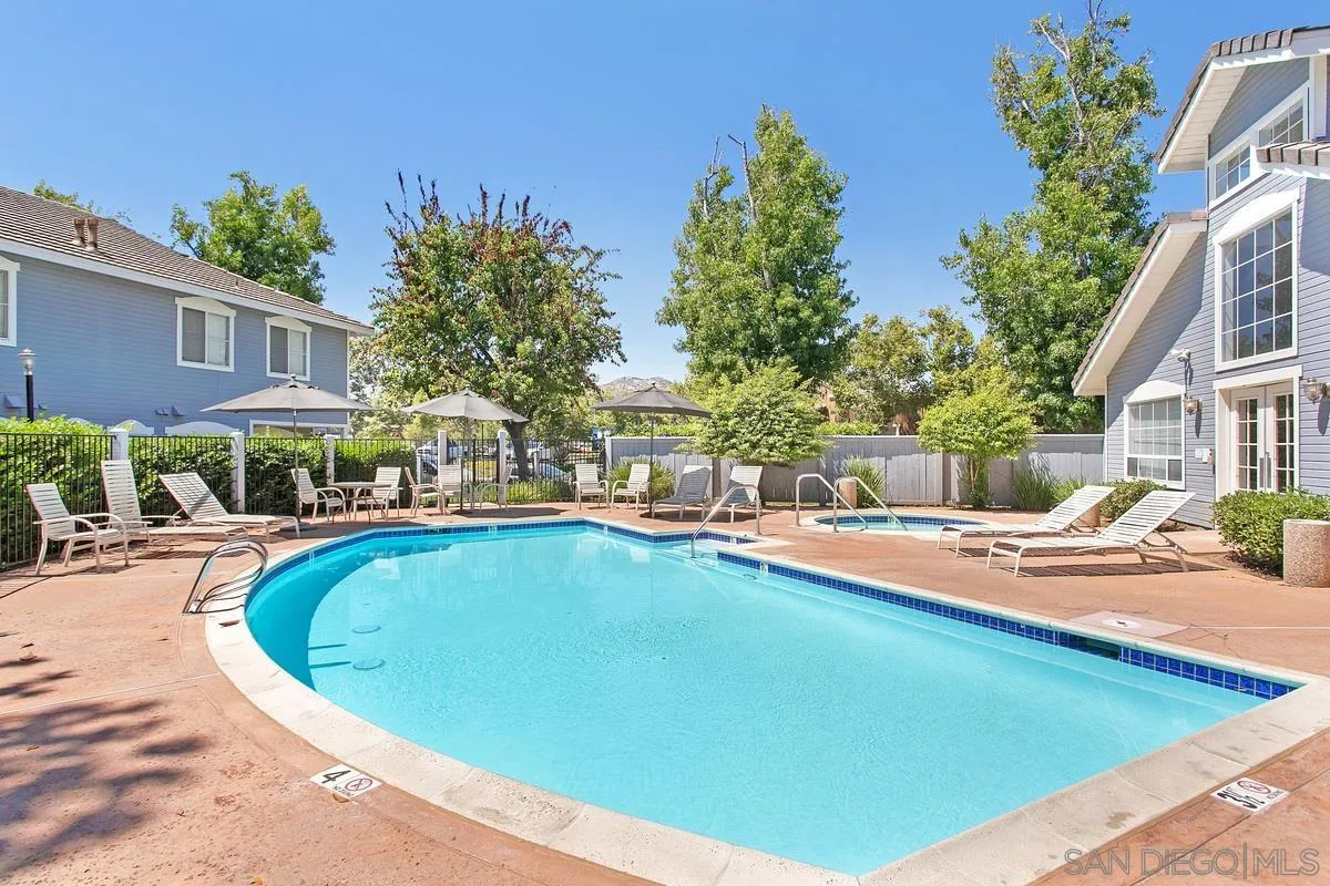 13975 Midland Road Poway, CA 92064 - Photo 30 of 33 a view of a swimming pool with a lounge chairs