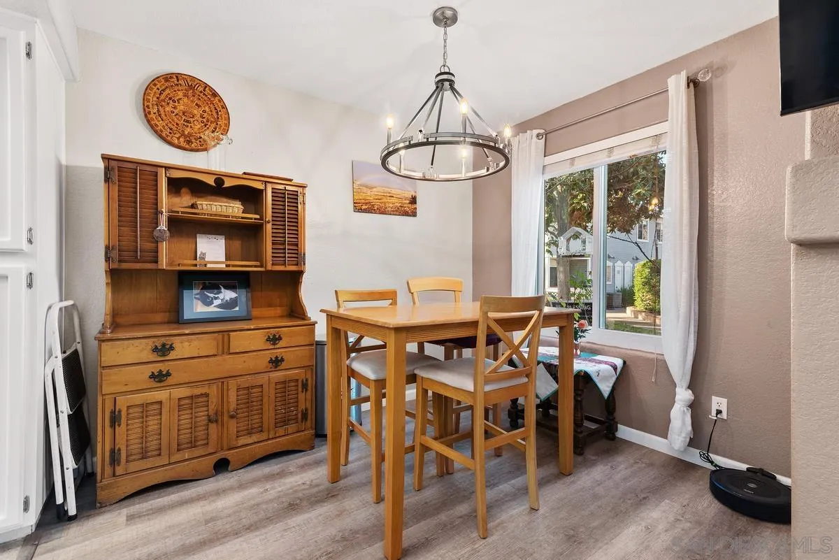 13975 Midland Road Poway, CA 92064 - Photo 8 of 33 a view of a dining room with furniture window and wooden floor