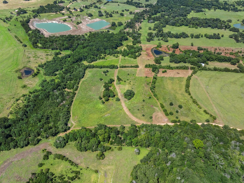 1190 North Nassau Road Round Top, TX 78954 - Photo 16 of 37 an aerial view of residential house with outdoor space and swimming pool