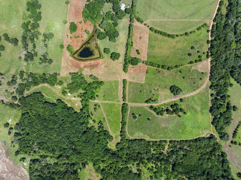 1190 North Nassau Road Round Top, TX 78954 - Photo 18 of 37 an aerial view of a residential houses with outdoor space