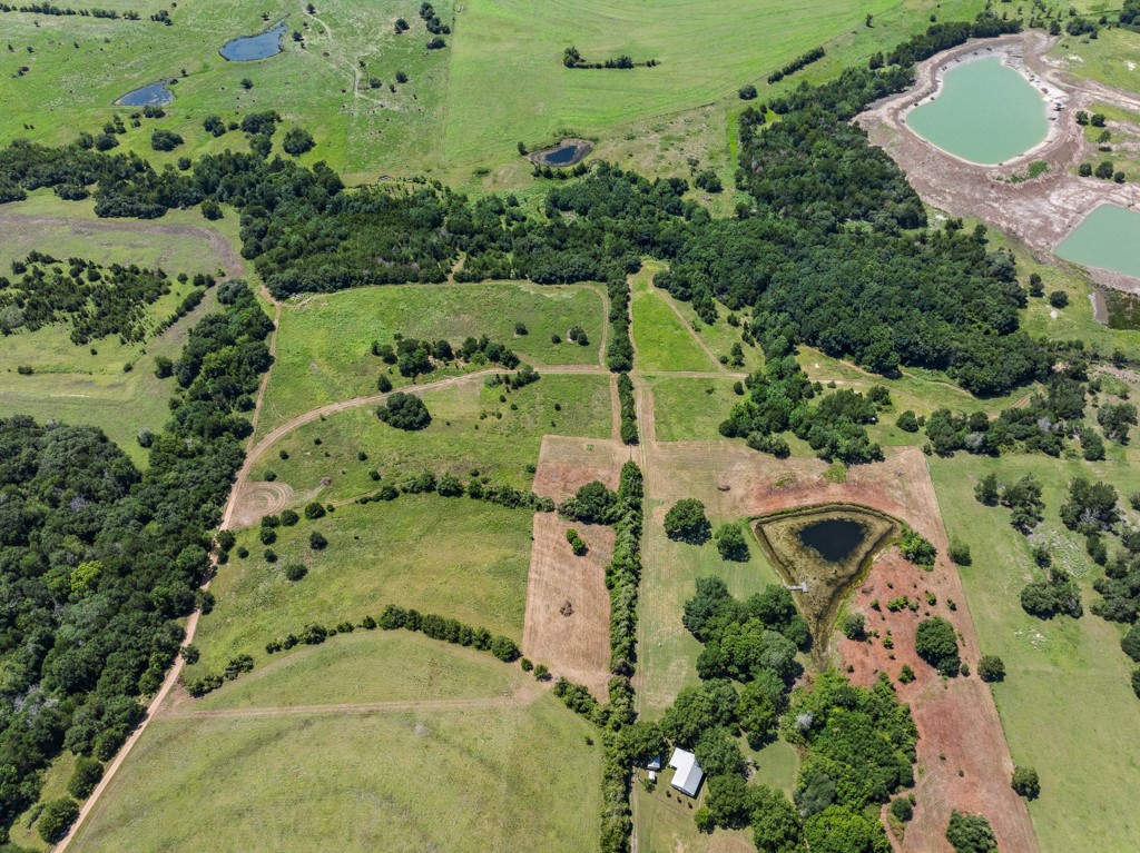 1190 North Nassau Road Round Top, TX 78954 - Photo 19 of 37 an aerial view of a house with outdoor space