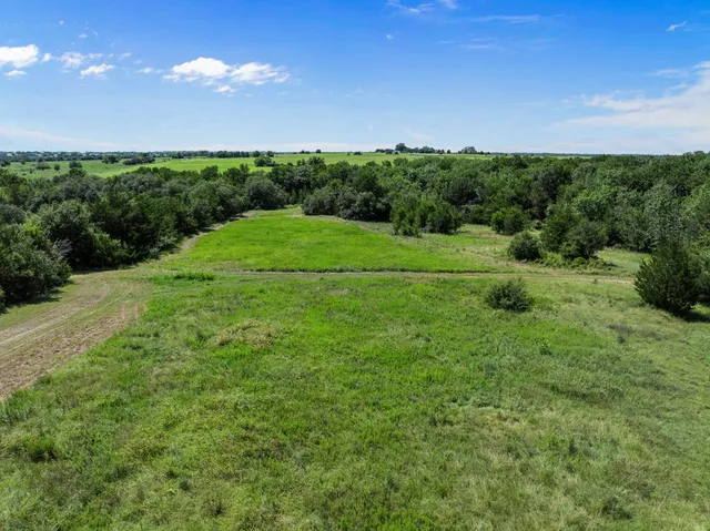 an aerial view of a green valley