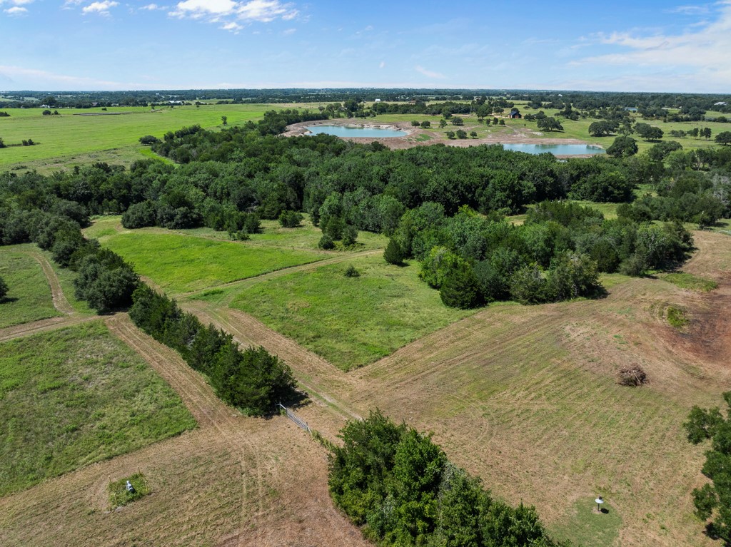 1190 North Nassau Road Round Top, TX 78954 - Photo 33 of 37 an aerial view of a yard with a yard