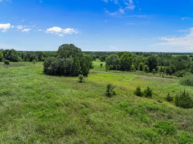 a view of a lake with a yard