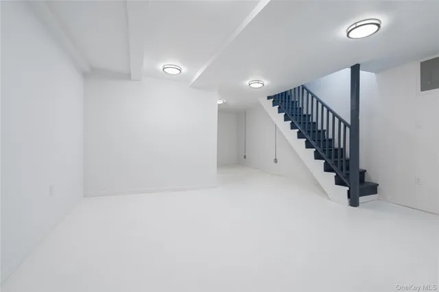 a view of an empty room with stairs