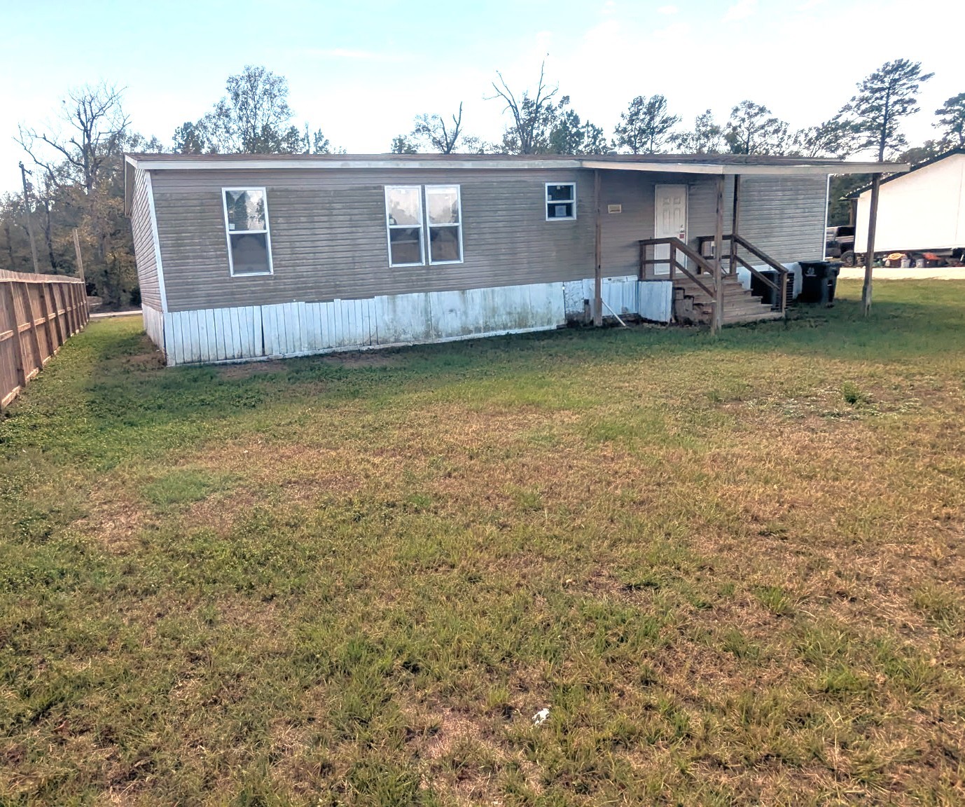 15695 Schank Road Conroe, TX 77306 - Photo 14 of 14 a view of a house with a big yard