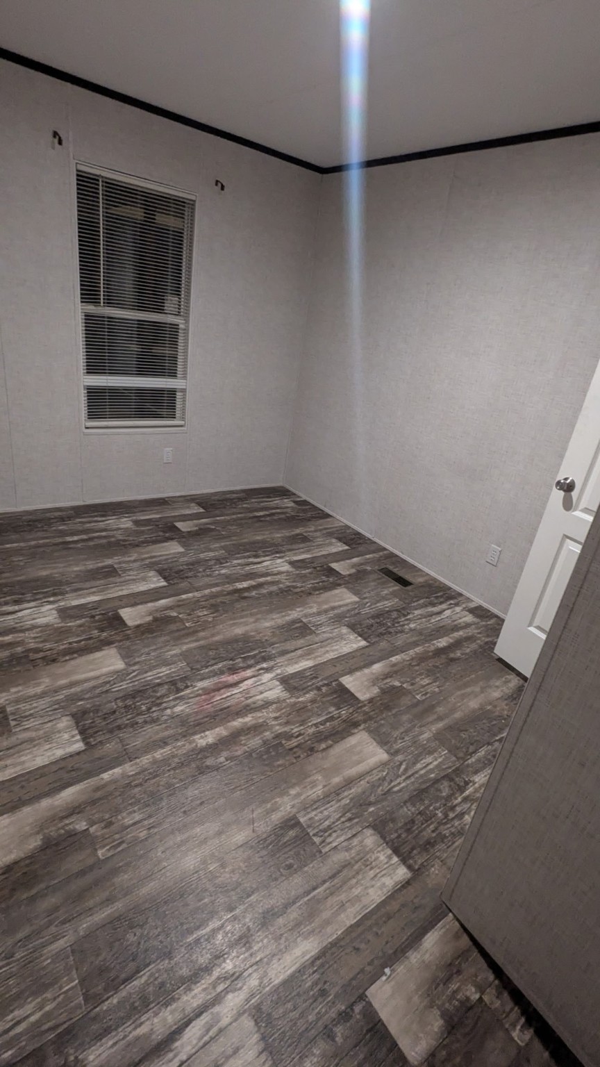 15695 Schank Road Conroe, TX 77306 - Photo 7 of 14 a view of an empty room with a window