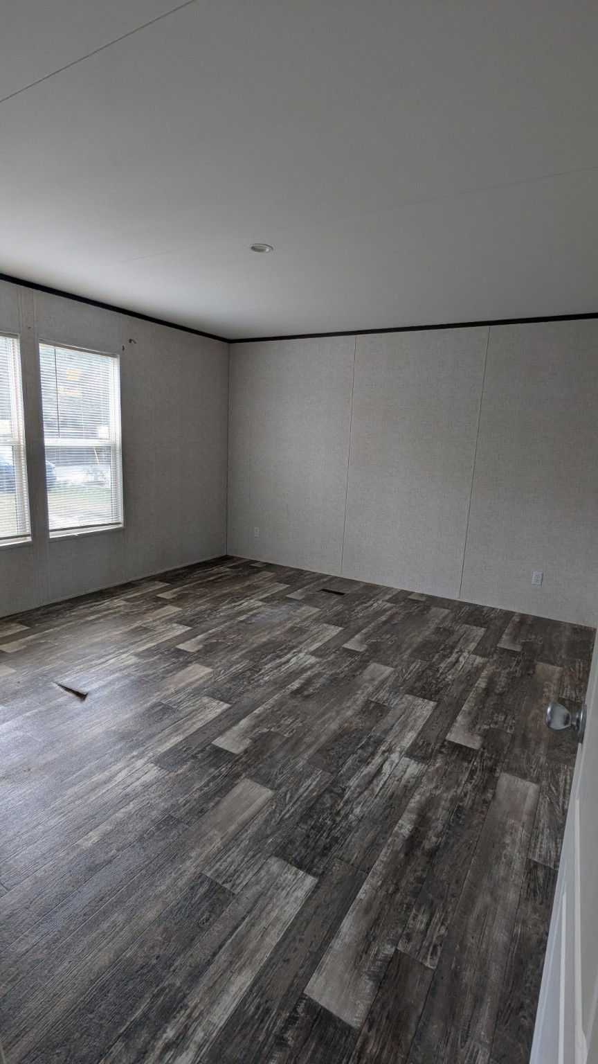 15695 Schank Road Conroe, TX 77306 - Photo 10 of 14 an empty room with a workbench