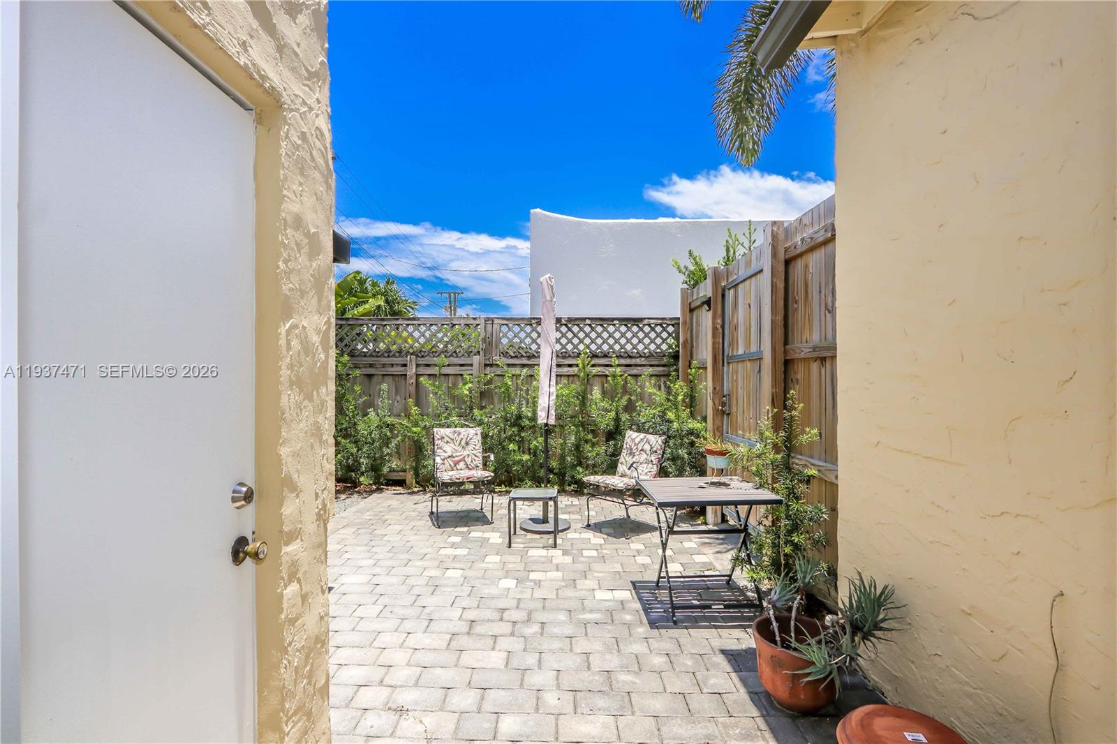 2477 Southwest 22nd Terrace Miami, FL 33145 - Photo 13 of 14 a view of a patio with couches and potted plants