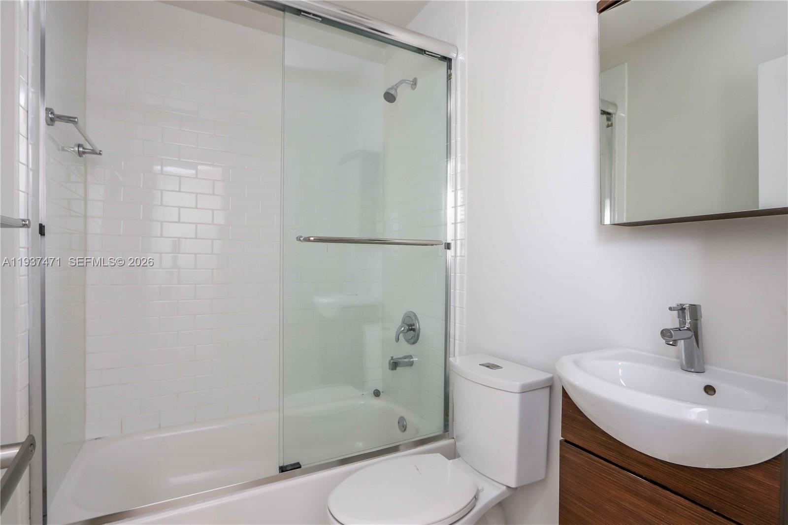 2477 Southwest 22nd Terrace Miami, FL 33145 - Photo 4 of 14 a bathroom with a sink a toilet and shower