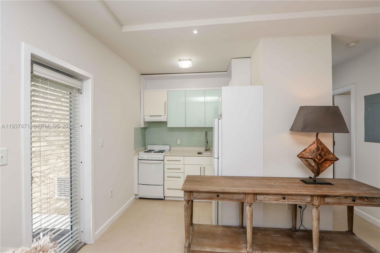 2477 Southwest 22nd Terrace Miami, FL 33145 - Photo 9 of 14 a kitchen with a table and chairs