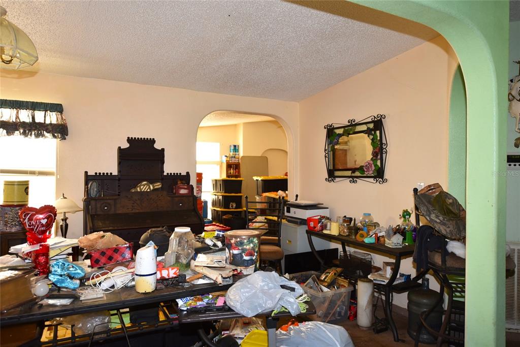 11542 Sumner Road Wimauma, FL 33598 - Photo 13 of 65 a living room with lots of furniture and a flat screen tv