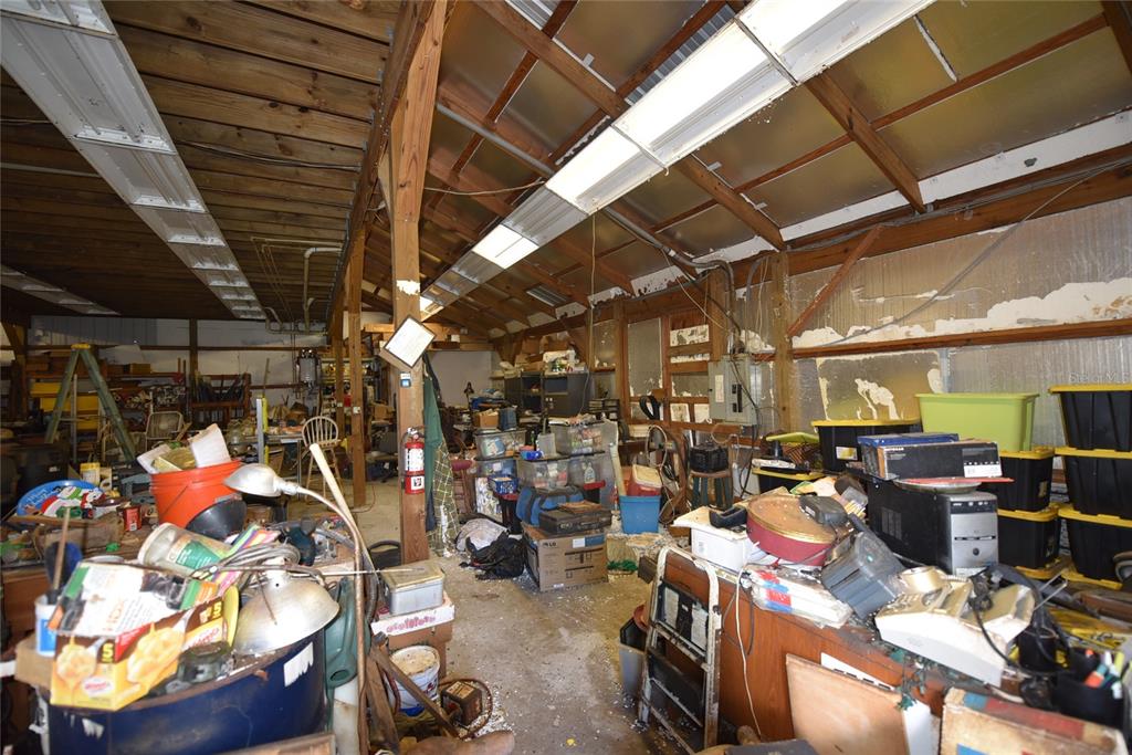 11542 Sumner Road Wimauma, FL 33598 - Photo 23 of 65 a view of a storage room with racks