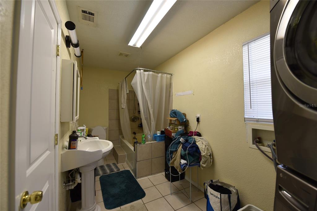 11542 Sumner Road Wimauma, FL 33598 - Photo 31 of 65 a bathroom with a sink a toilet and a mirror