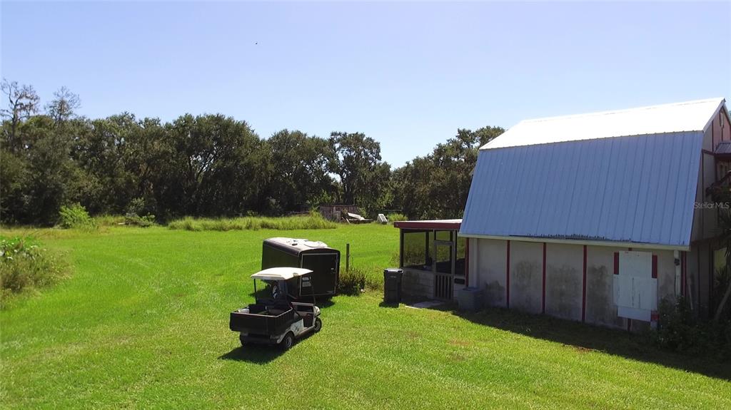 11542 Sumner Road Wimauma, FL 33598 - Photo 35 of 65 a backyard of a house with table and chairs