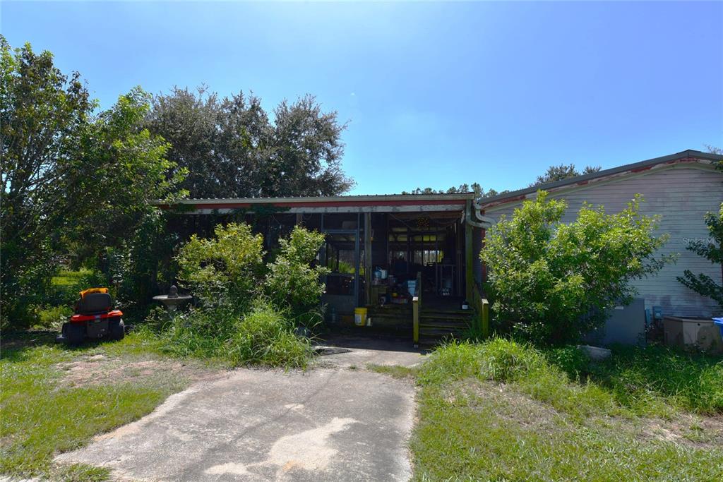 11542 Sumner Road Wimauma, FL 33598 - Photo 50 of 65 an outdoor view with patio