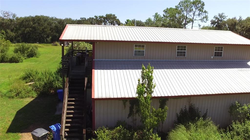 11542 Sumner Road Wimauma, FL 33598 - Photo 6 of 65 a aerial view of a house with a yard and potted plants