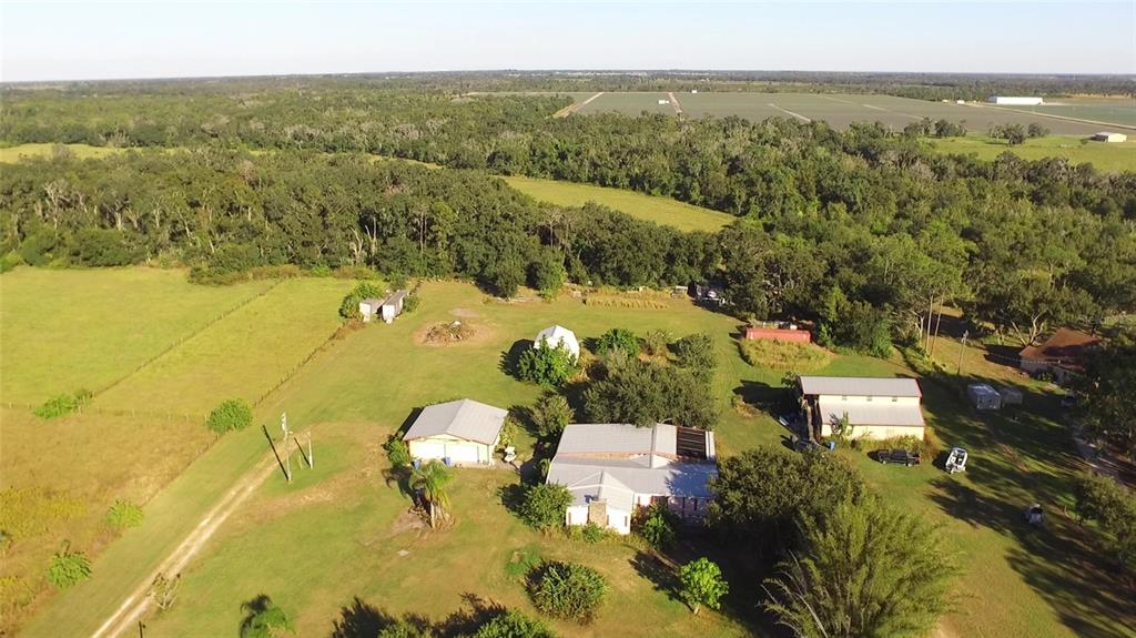 11542 Sumner Road Wimauma, FL 33598 - Photo 63 of 65 an aerial view of residential houses with outdoor space