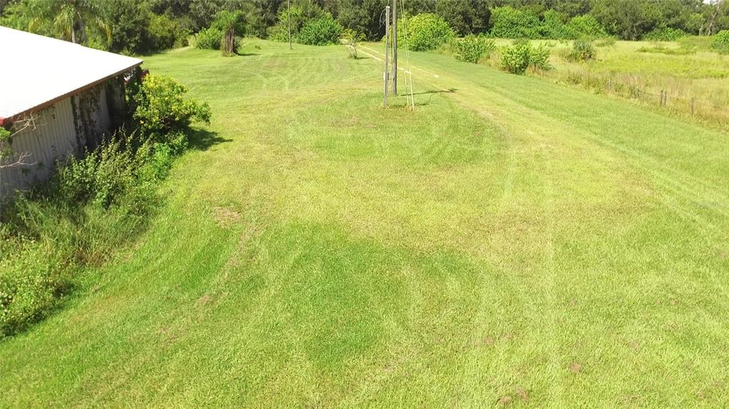 11542 Sumner Road Wimauma, FL 33598 - Photo 7 of 65 a view of an outdoor space and a yard