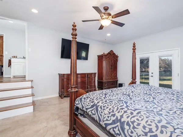 a bed room with a bed and a television