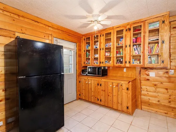 a kitchen with stainless steel appliances a refrigerator and a sink