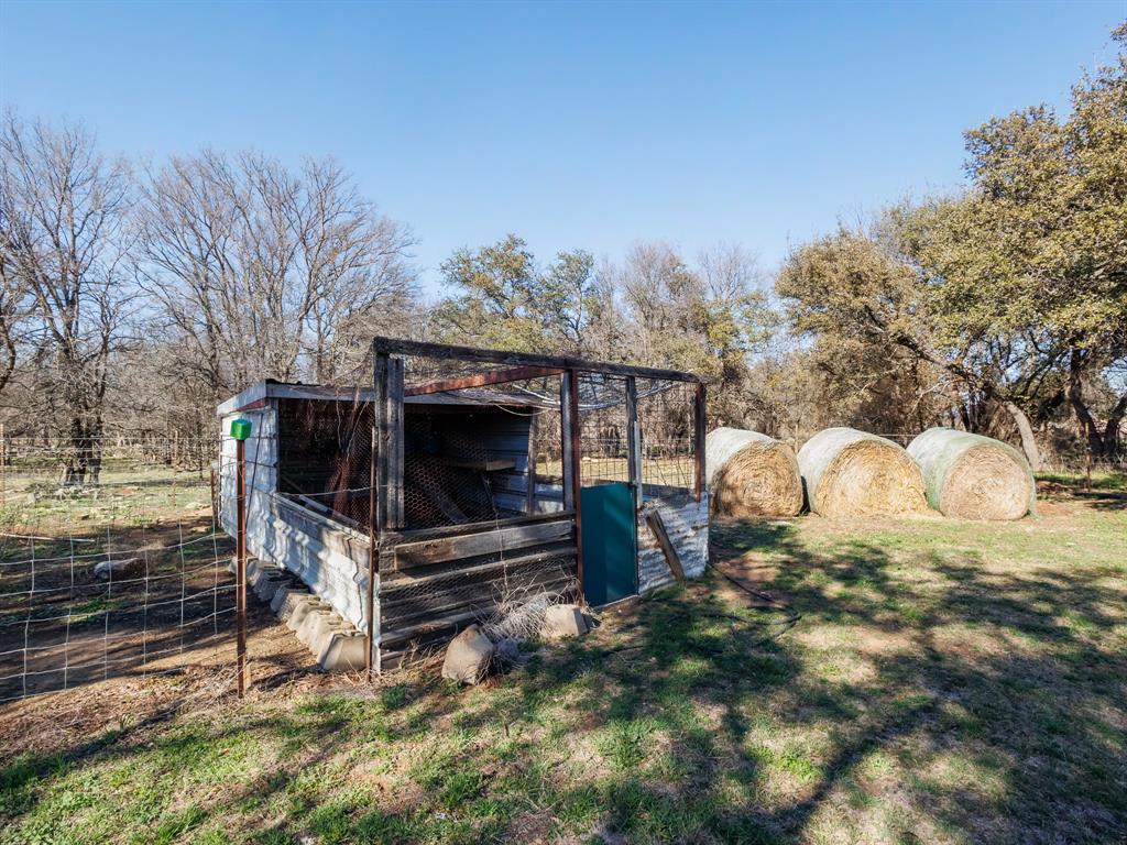 3301 County Road 339 Early, TX 76802 - Photo 28 of 39 a view of backyard with a fireplace