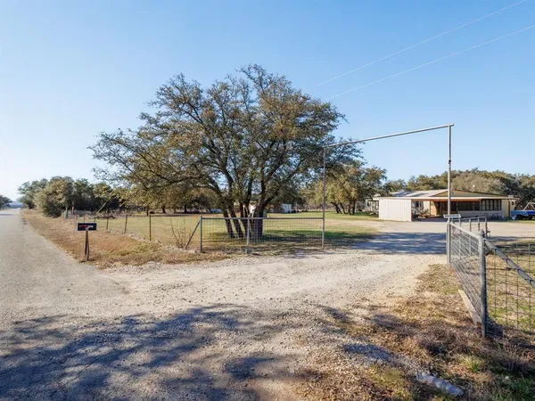 a view of backyard with green space